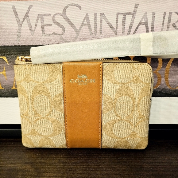 Coach Handbags - Coach Tan and Cream Wristlet NWT.